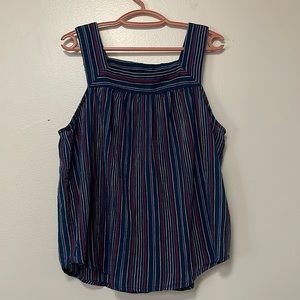Lightweight dark blue blouse. With light blue, red and lavender stripes.